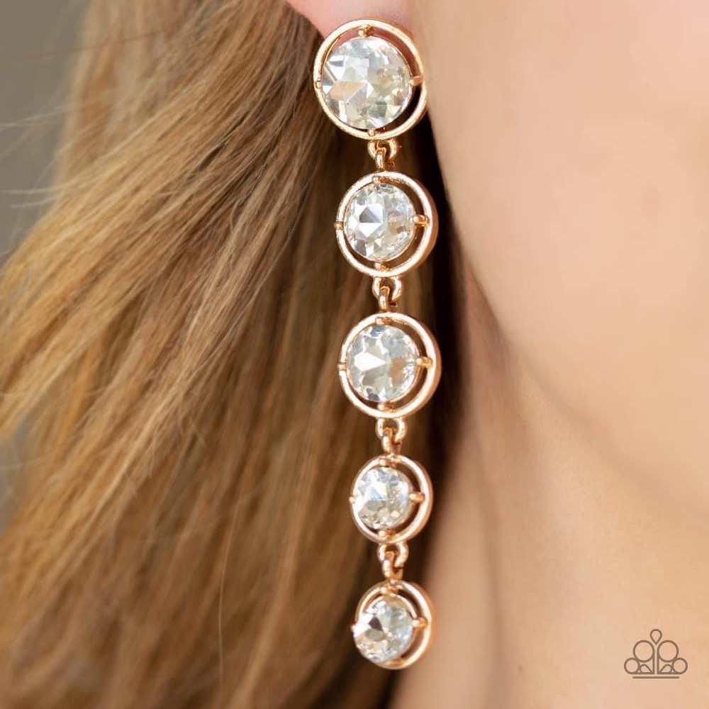Gold long earrings with a hint of bling.  Classy look.